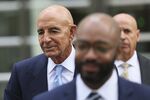 Colony Capital LLC founder Tom Barrack, left, leaves federal court in Brooklyn, on Sept. 19. 