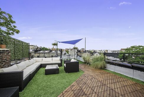 The townhouse boasts a full roof deck.