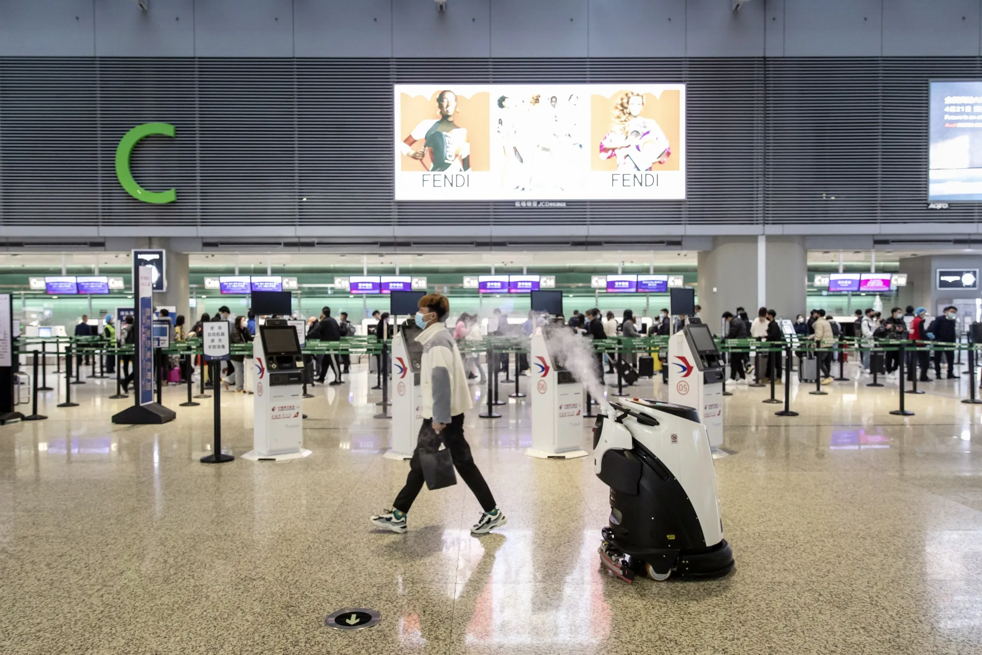 A robot sprays disinfectant at the Hongqiao International Airport in Shanghai.