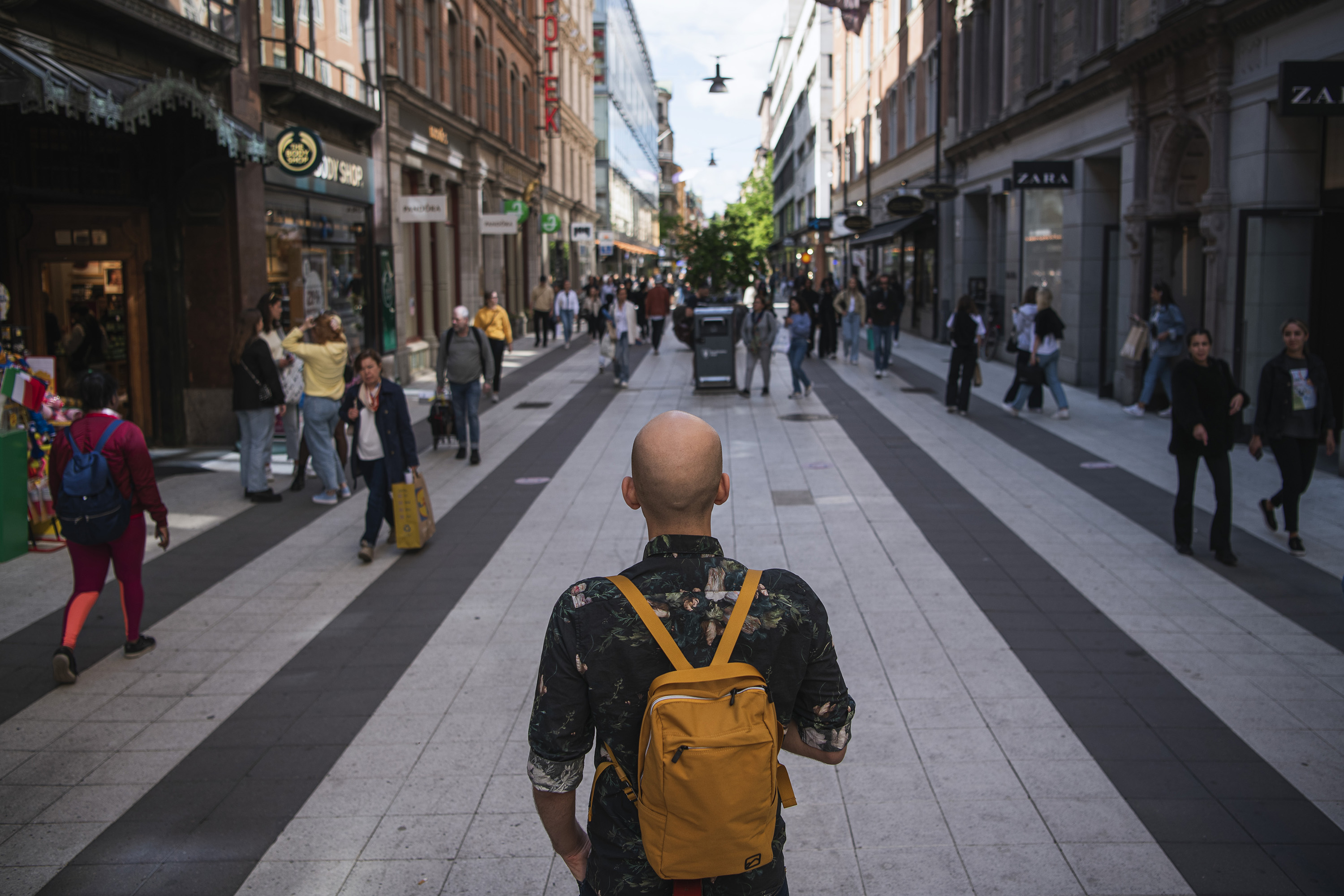 People walk past stores in Drottninggatan in Stockholm