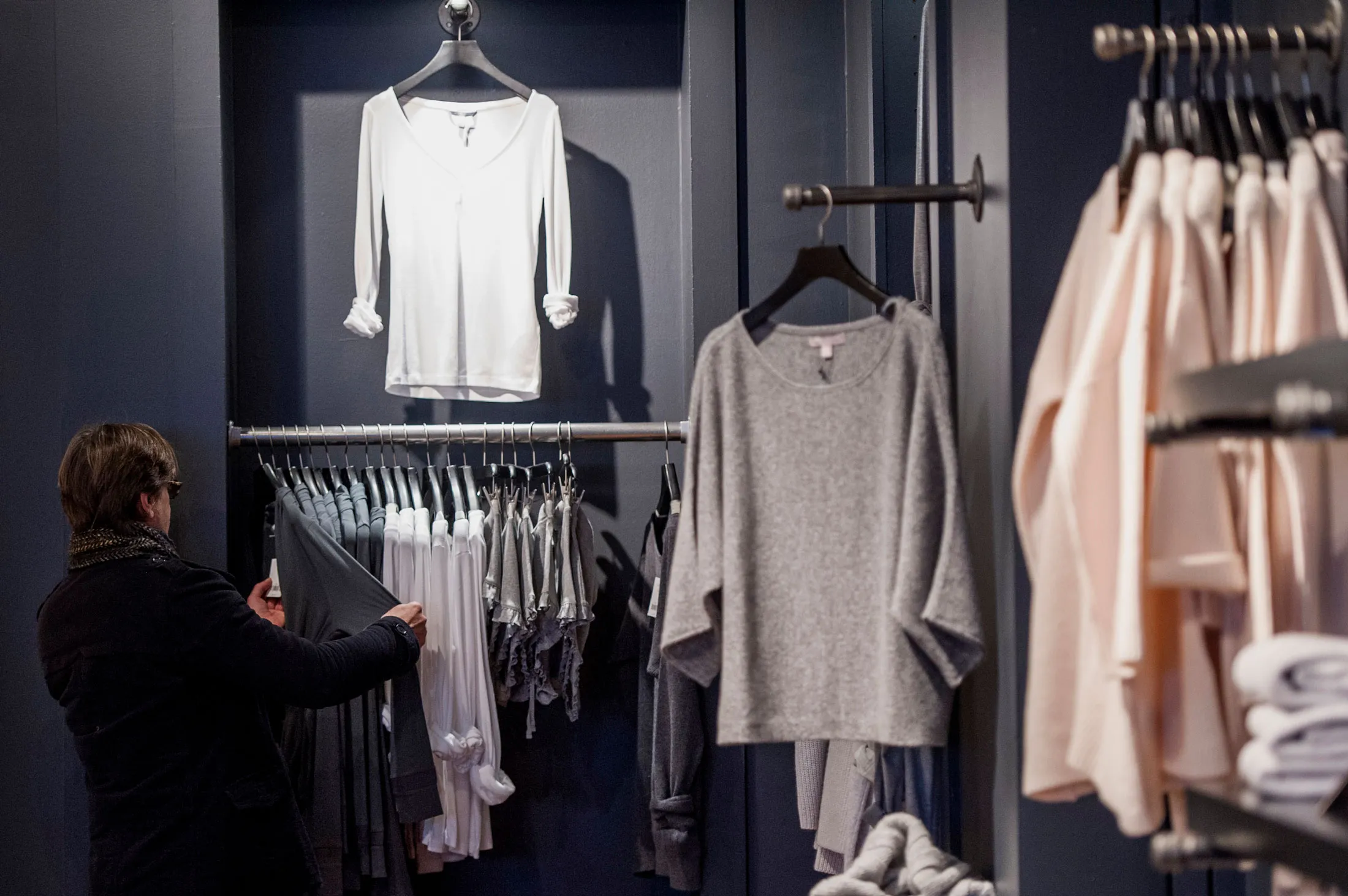 A shopper browses merchandise at a Banana Republic LLC store in San Francisco, California, U.S., on Thursday, Dec. 18, 2014.
