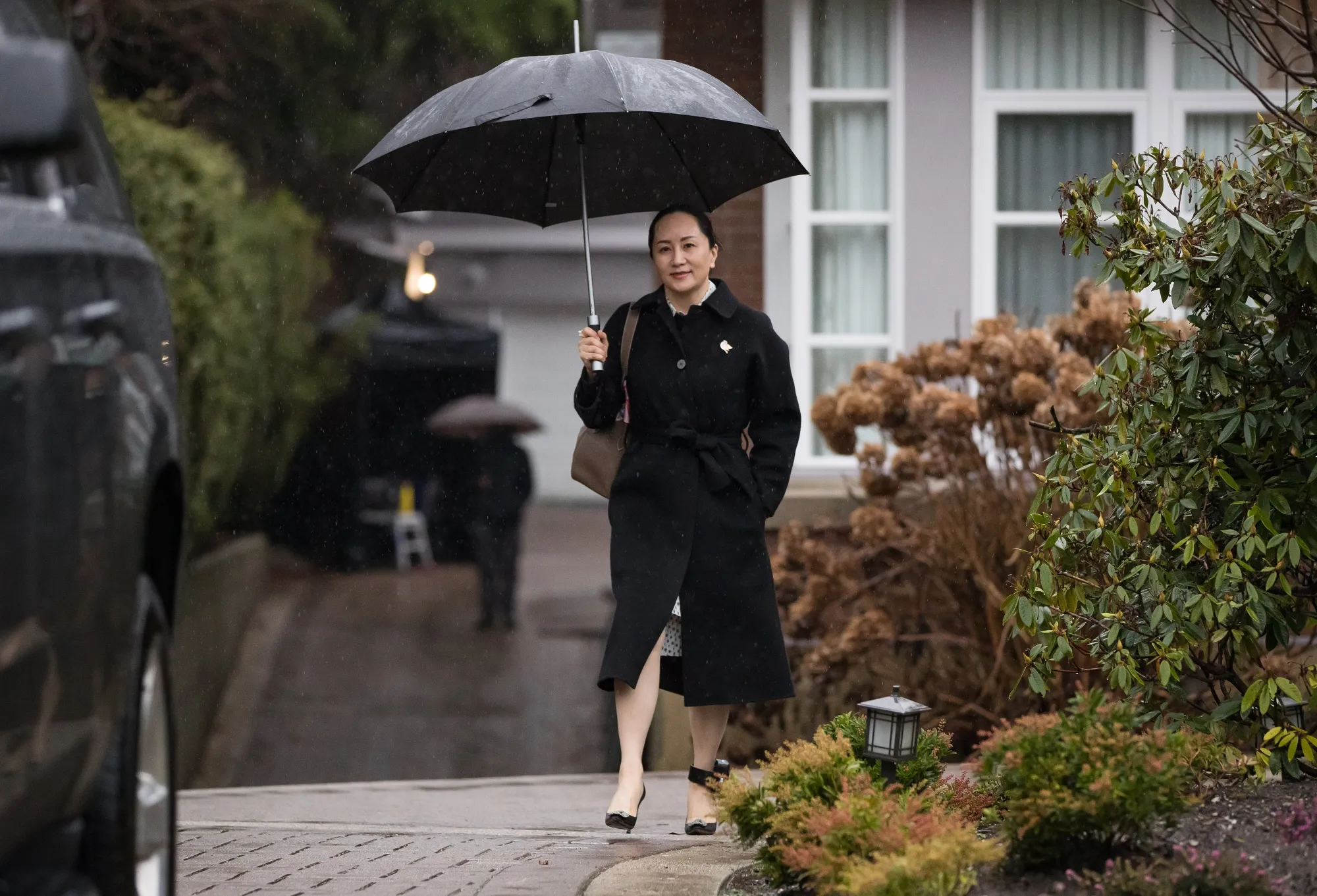 Meng Wanzhou leaves her home to attend an extradition hearing in Vancouver on Jan. 23.