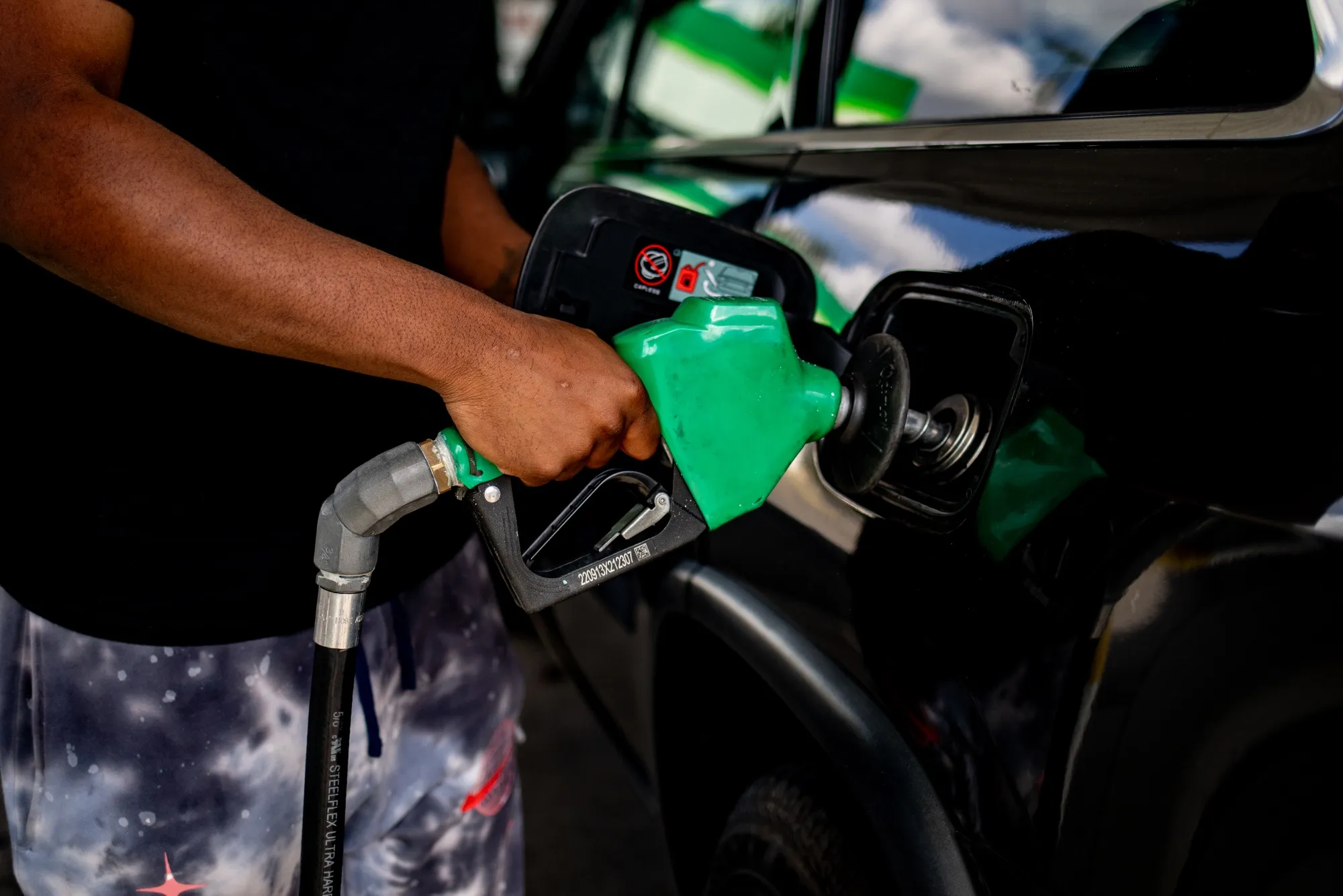A driver refuels their vehicle at a BP gas station in Detroit, Michigan, US.&nbsp;Food and prices at the gas pump accelerated during November, adding to already elevated inflation elsewhere in the US economy.