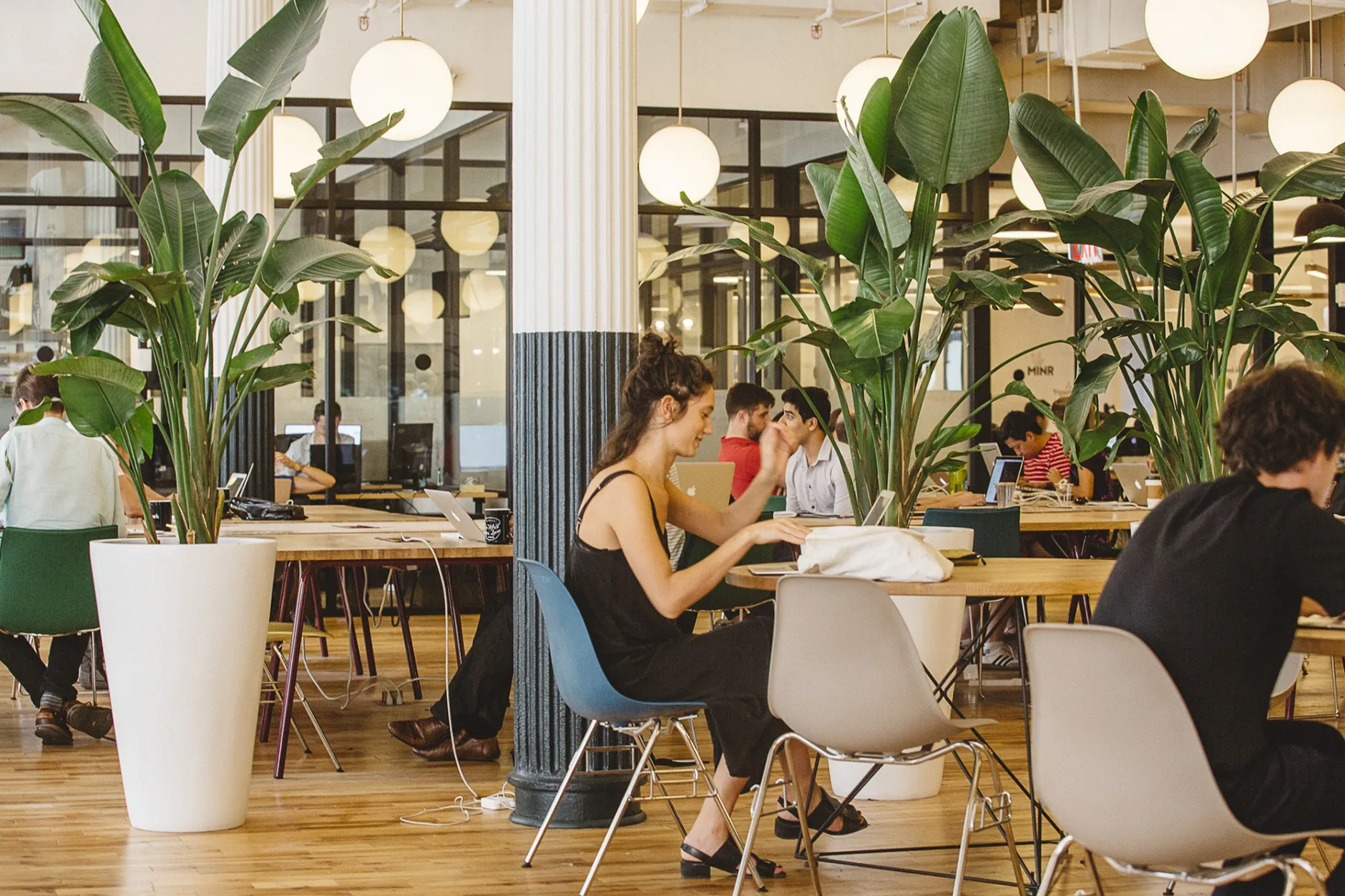 Members of WeWork sit at one of the company’s spaces in New York.