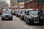Taxis queue outside Waterloo station in London