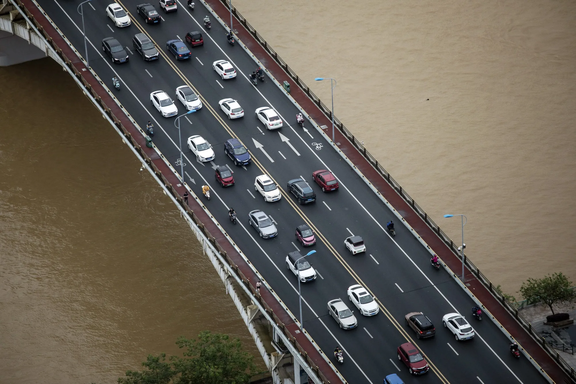 Vehicles travel along a bridge across Liu River in Liuzhou, China.