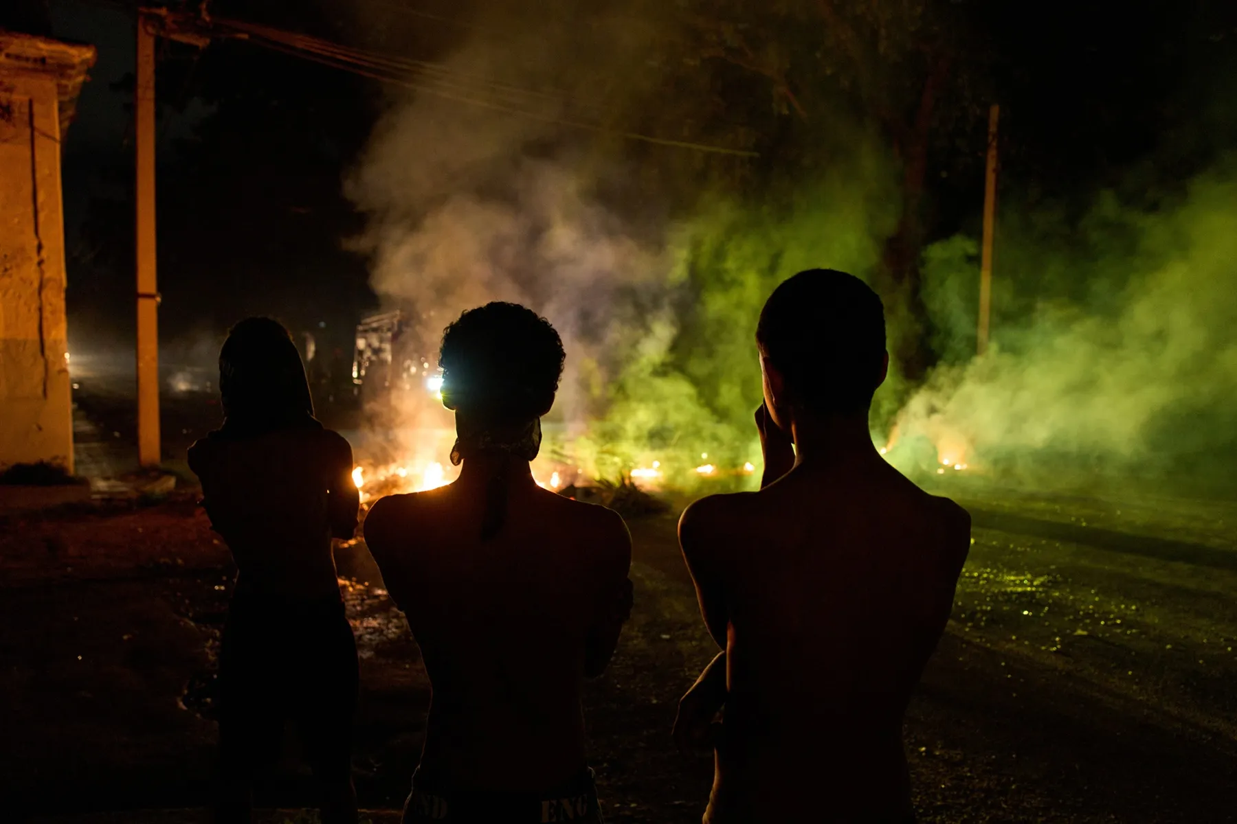 People look at a barricade set up by residents protesting against prolonged power outages in Havana on May 13.