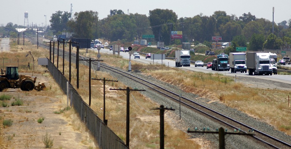 A stretch of the California State Route 99 corridor in the San Joaquin Valley is shown busy with pollution causing farm equipment, trucks and cars in Madera, California.