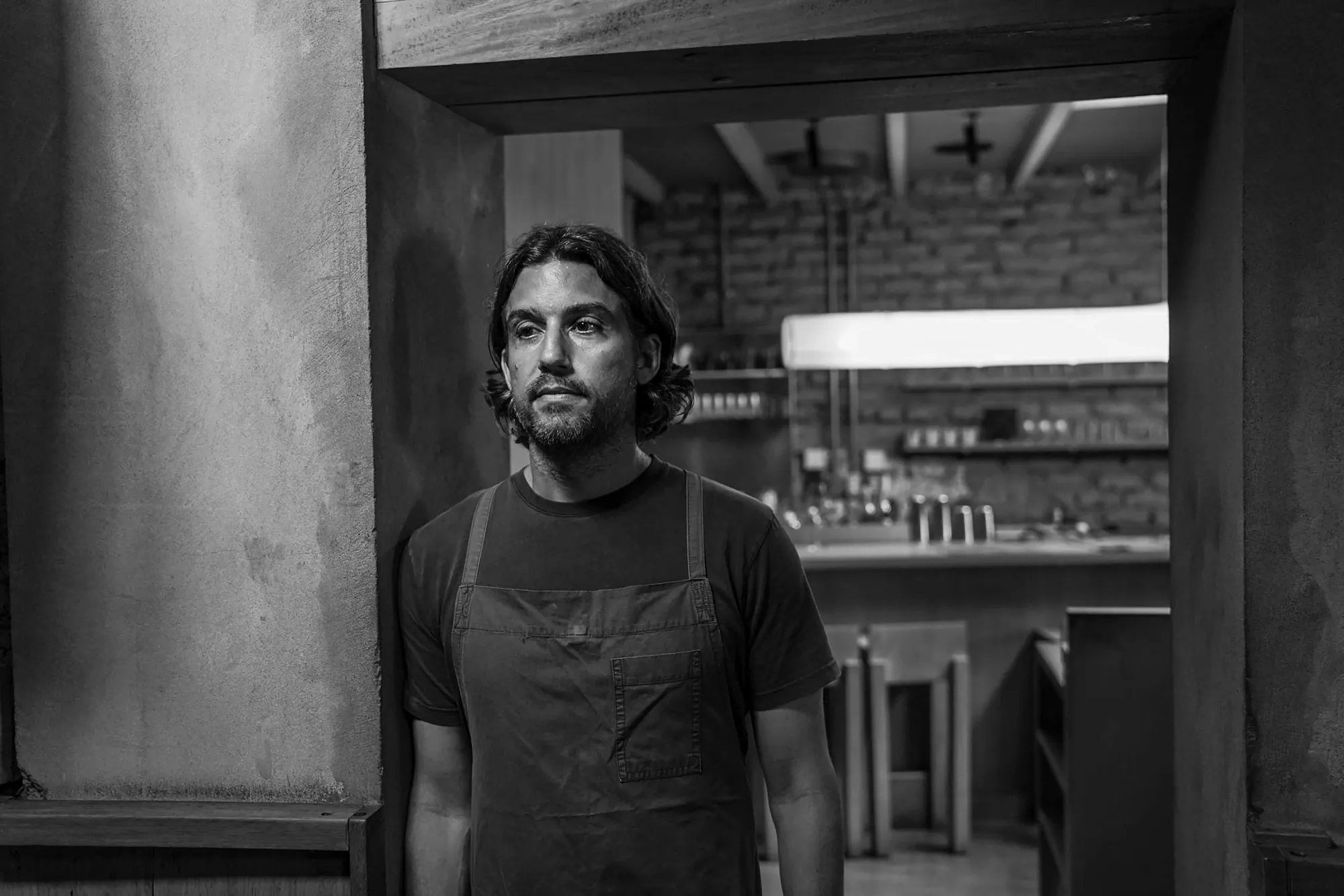 A black and white portrait of Chef Juan Luis Martínez.