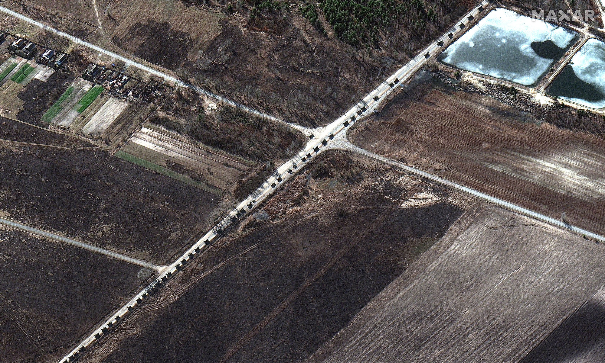 This satellite image provided by Maxar Technologies shows a&nbsp;military convoy northwest of Invankiv, Ukraine, on Feb. 28.