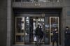 People enter Deutsche Bank AG headquarters on Wall Street in New York, U.S., on Thursday, April, 26, 2018.