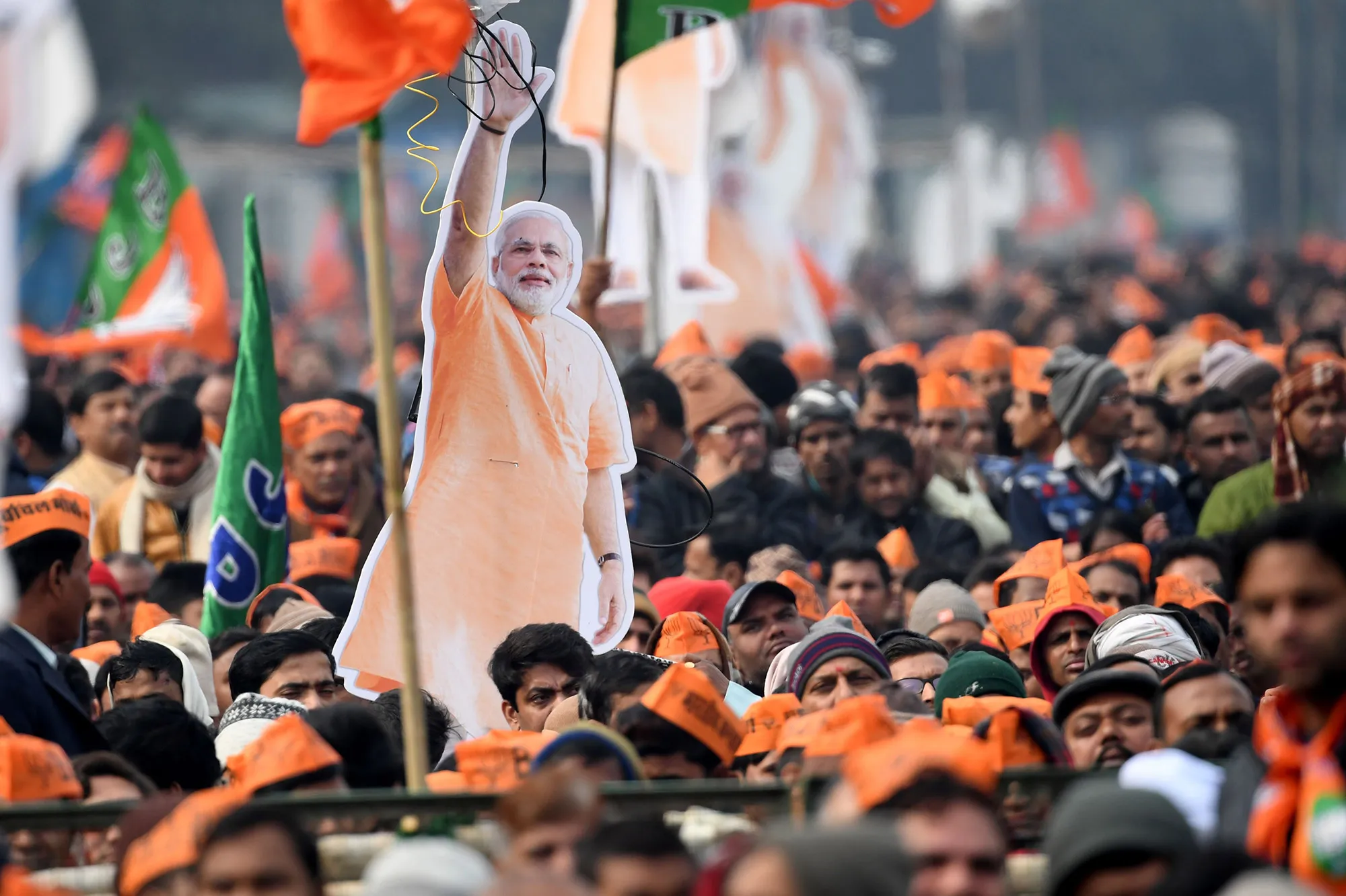 Supporters of the Bharatiya Janata Party (BJP) listen to Modi’s speech during a rally in New Delhi on Dec.&nbsp;22.