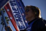 A voter holds a campaign sign during primary elections in Corpus Christi, Texas, on&nbsp;March 1.&nbsp;