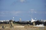 A missile is launched by an &quot;Iron Dome&quot; battery, a missile defence system designed to intercept and destroy incoming short-range rockets and artillery shells, in the southern Israeli city of Ashdod on July 18, 2014. Photographer: David Buimovitch/AFP via Getty Images