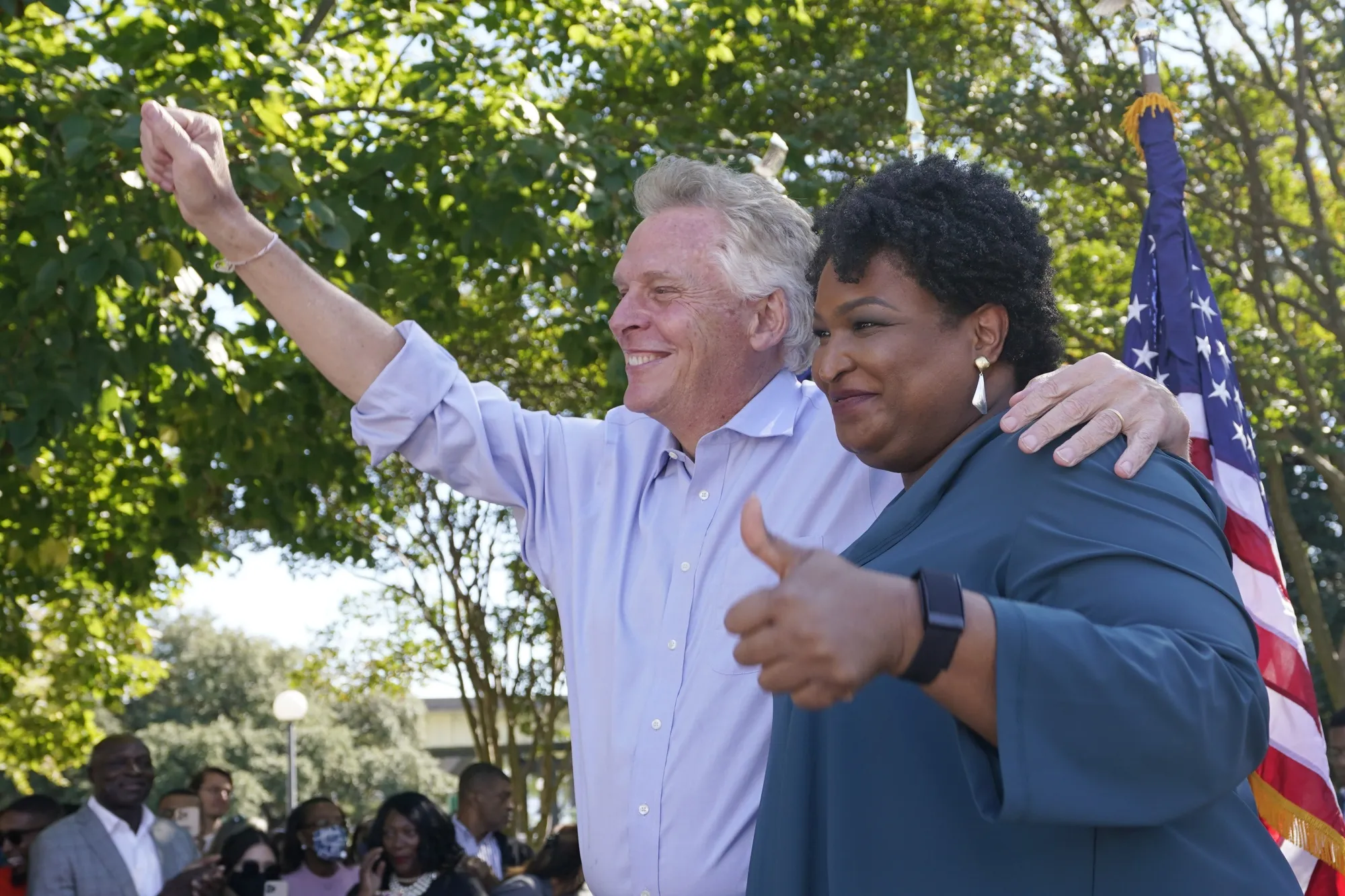 Stacey Abrams, right, joins Terry McAuliffe, during a campaign rally in Norfolk, on Oct. 17.