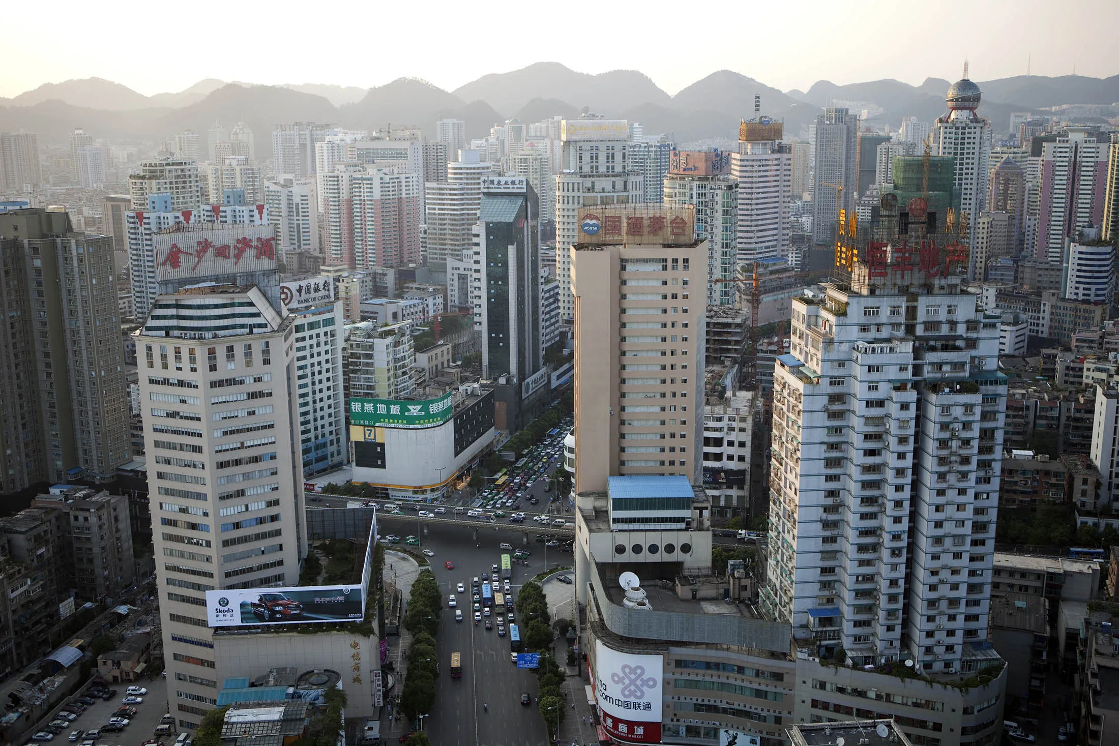 Looking down at the modern and booming city of Guiyang, the capital of China's remote Guizhou Province. Guiyang is not only the capital city of the Guizhou Province, it is also the economic and commercial hub.
