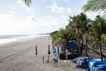 Closed parasols are seen on a beach temporarily closed due to the coronavirus in Kuta, Bali on June 22.