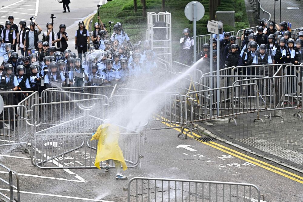 Hong Kong Markets Roiled by Interbank Rate Squeeze Amid Protests