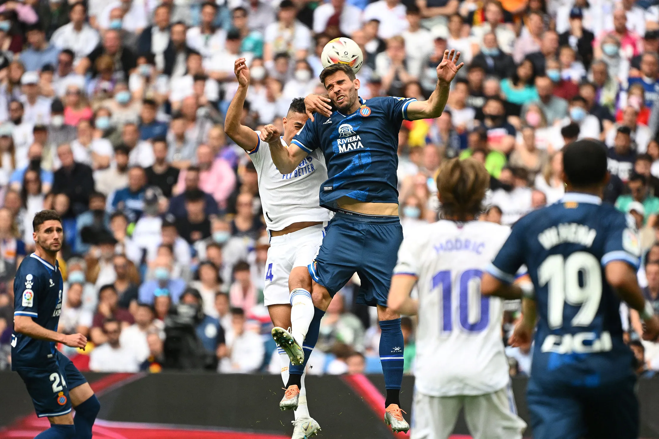 Players challenge the ball during a La Liga&nbsp;football match between Real Madrid CF and RCD Espanyol at the Santiago Bernabeu stadium in Madrid on April 30.