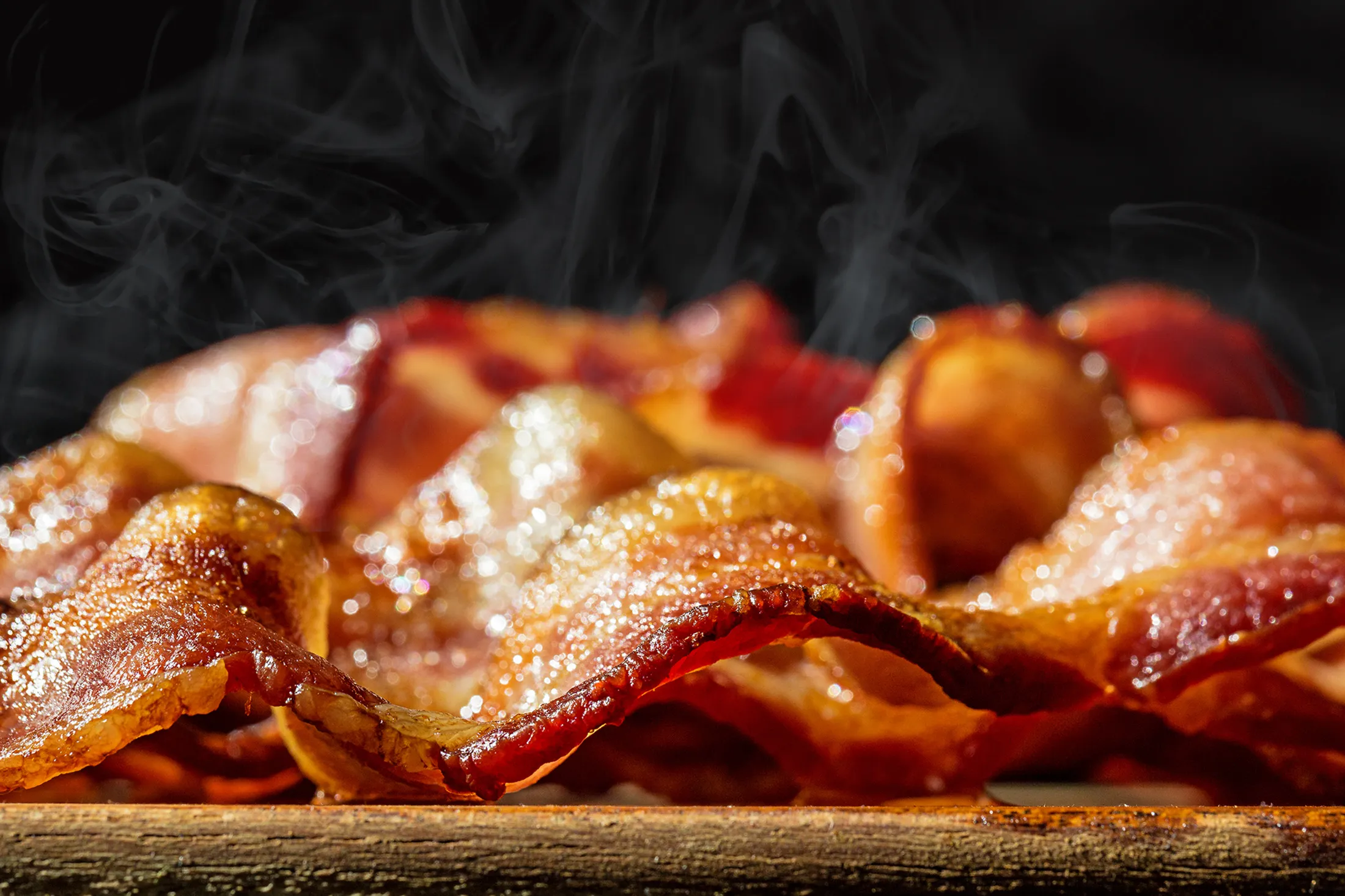 RF - Closeup Pile of Hot Sizzling Bacon