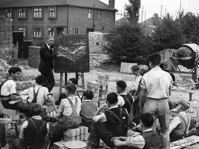 Apprentice builders attending a theory lesson on site at an Ealing Council estate development in 1947.