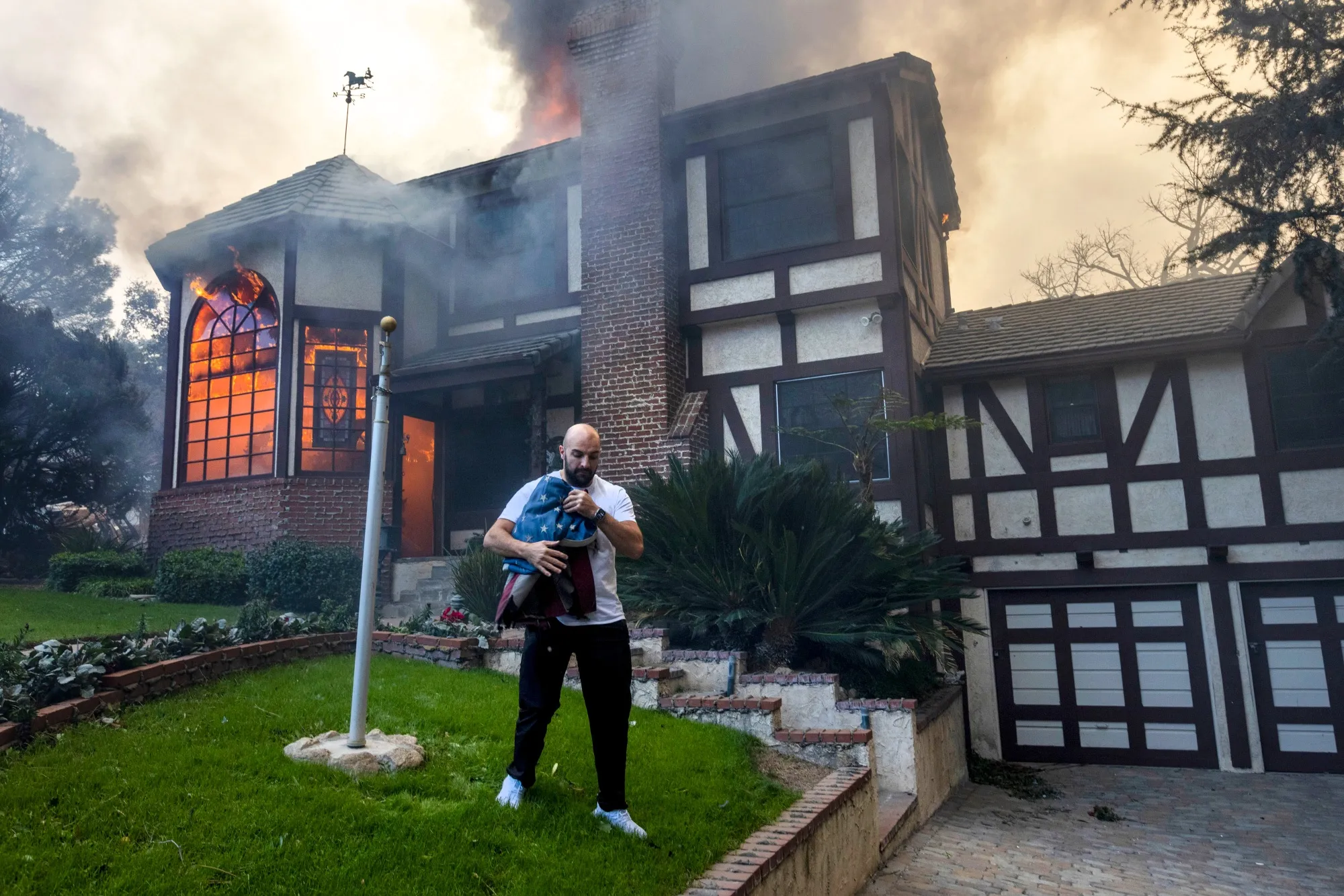 Thousands Flee From Uncontrolled Wildfires Burning Near LA Thousands Flee From Uncontrolled Wildfires Burning Near LA