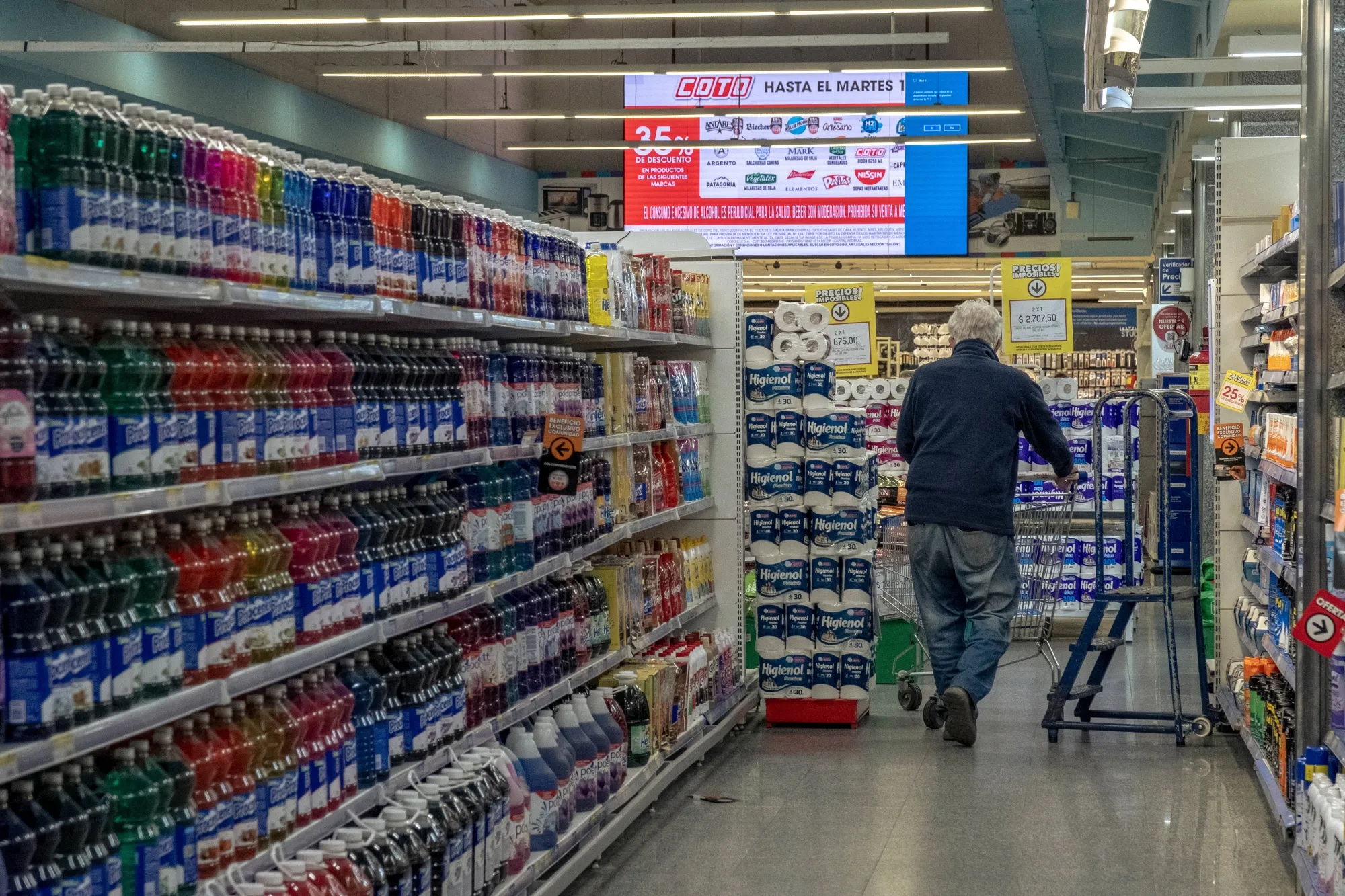 A shopper browses products at a grocery store in Buenos Aires.