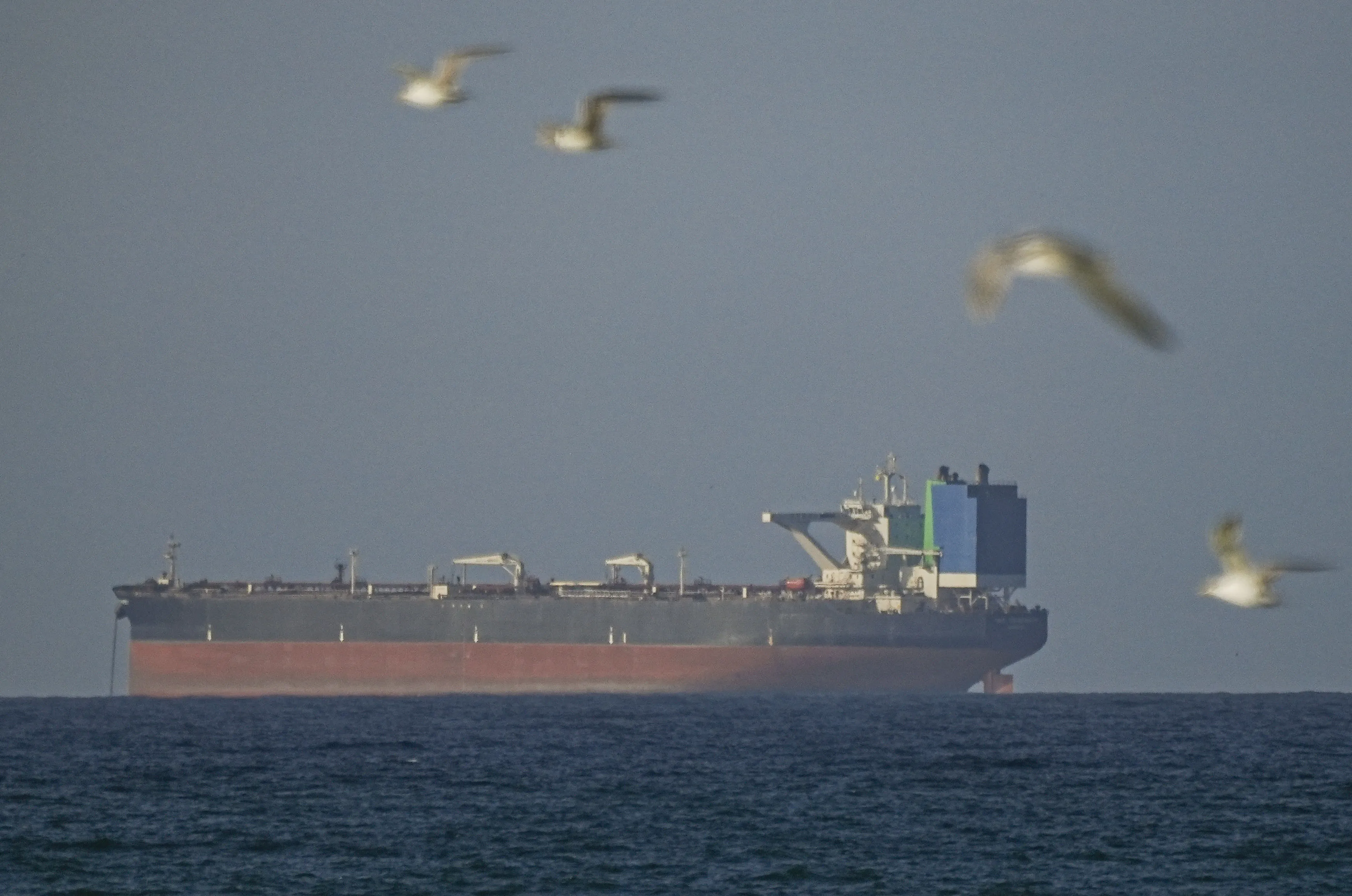 A ship waits to pass through the Strait of Hormuz in Oman on April 8.