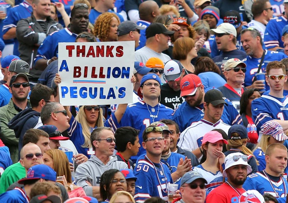 A fan holds a sign thanking prospective Buffalo Bills owners Terry and Kim Pegula during the first half of an NFL football in Orchard Park, N.Y. (September 14, 2014)
