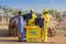 Azuri agents delivering a solar home system.
