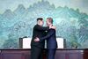 Kim and Moon Jae-in hug after signing a deal to seek an end to a seven-decade war during the Inter-Korean summit on April 27.
