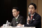 Takeshi Idezawa, chief executive officer of Line Corp., right, speaks beside Kentaro Kawabe, president and chief executive officer of Z Holdings Corp., formerly known as Yahoo Japan, during a news conference in Tokyo.