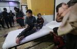 Children wait to receive treatment after the alleged chemical attack in Damascus on April 07