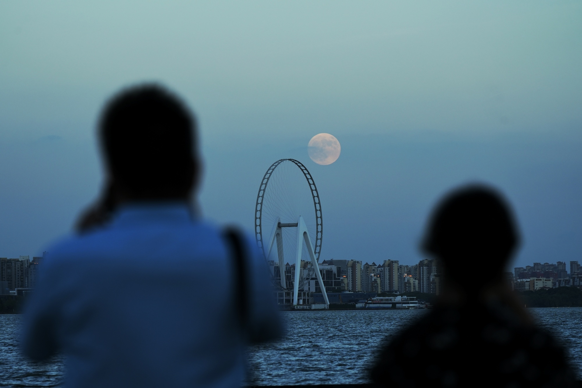 SUZHOU, CHINA - SEPTEMBER 17: The full moon appears on the night sky over the Jinji Lake during Mid-Autumn Festival holiday on September 17, 2024 in Suzhou, Jiangsu Province of China. (Photo by Zhang Xiangyi/China News Service/VCG via Getty Images)