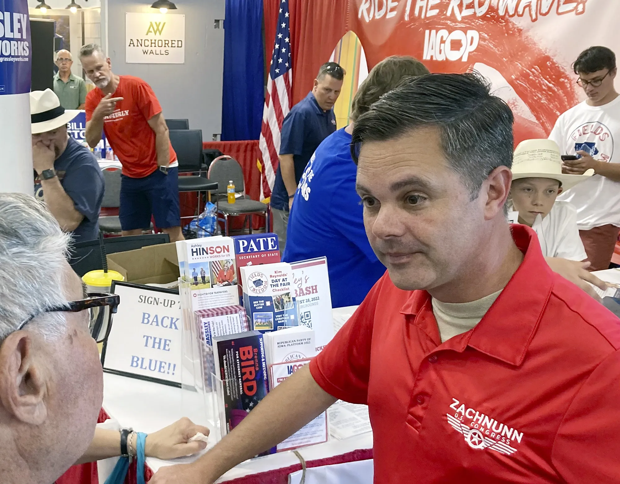 Zach Nunn visits the Iowa Republican Party booth at the Iowa State Fair in Des Moines, on Aug. 12.