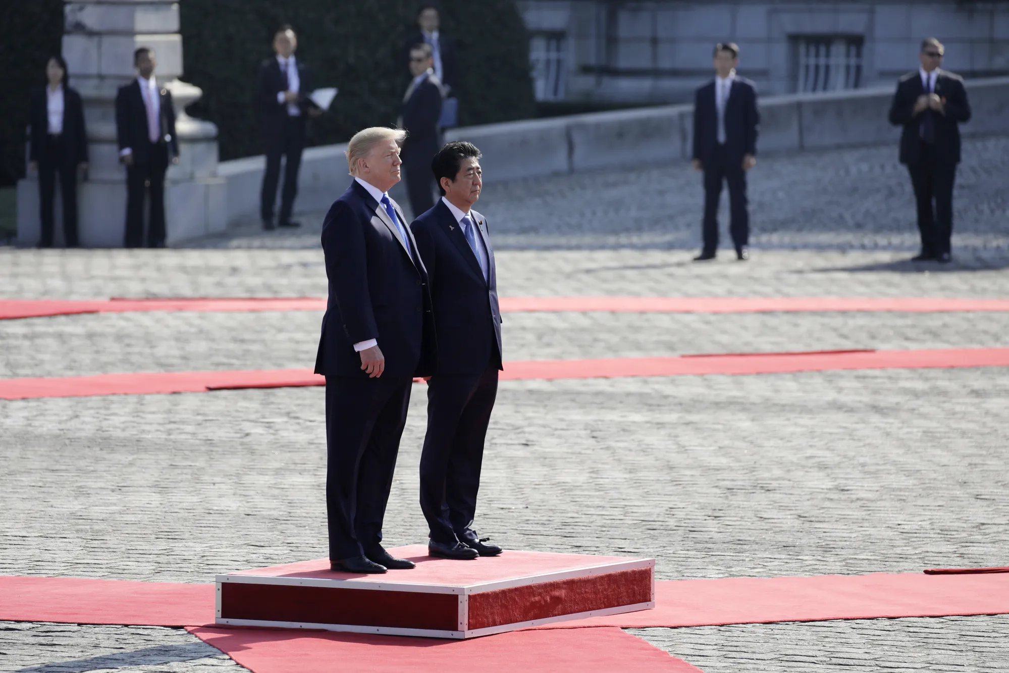 U.S. President Donald Trump and Shinzo Abe, Japan's prime minister, observe an honor guard at Akasaka Palace in Tokyo on&nbsp;Nov. 6.