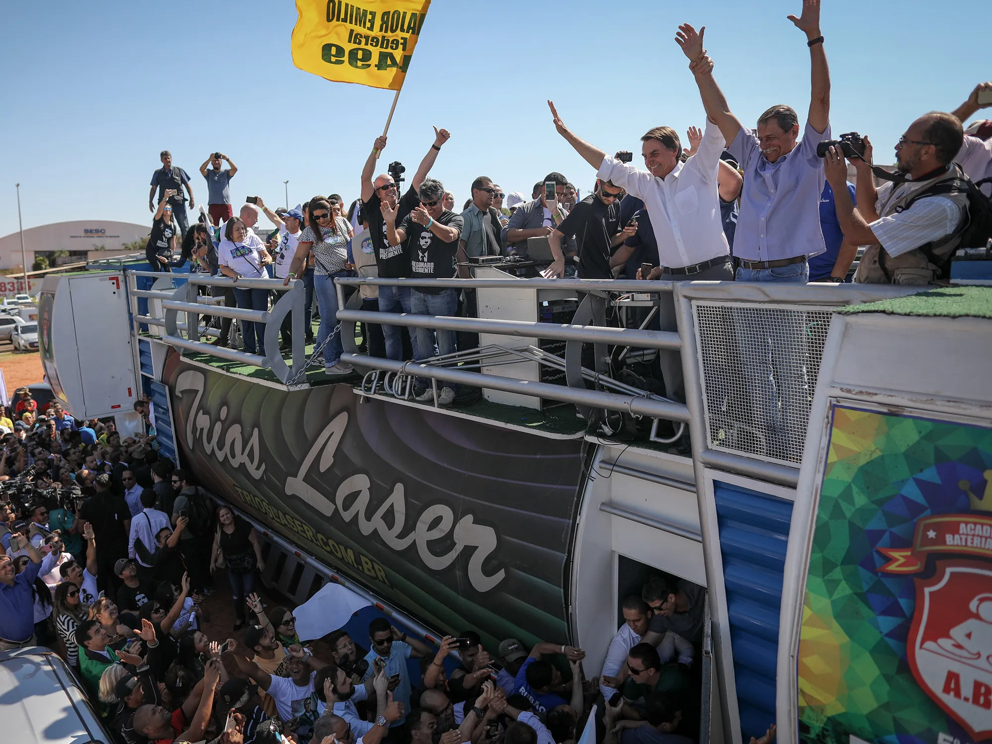 Jair Bolsonaro, presidential candidate for the Social Liberal Party, third right, and Paulo Chagas, candidate for governor of the Distrito Federal, second right, wave to supporters during a campaign rally Ceilandia, Brazil, on&nbsp;Sept. 5, 2018.&nbsp;
