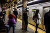 Commuters stand on the platform while waiting for the 7 train at the Vernon Boulevard-Jackson Avenue subway station in the Long Island City neighborhood in the Queens borough of New York, U.S., on Friday, Nov. 9, 2018. As reports emerged this week that Amazon.com Inc. was close to an agreement to set up a new office hub in Long Island City, the prospect of all those jobs, shoppers, and potential tenants or homebuyers drew cheers in the fast-growing neighborhood across the East River from Manhattan.