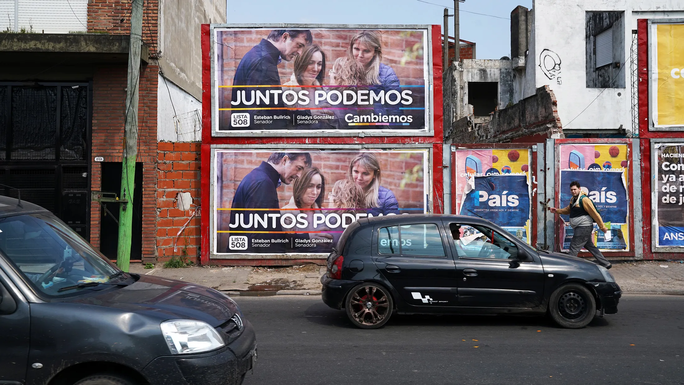 A vehicle drives past campaign posters for candidate Esteban Bullrich displayed on a wall in the Hurlingham neighborhood of Buenos Aires, Argentina, on Monday, Sept. 25, 2017. The opposition candidate in Buenos Aires is Macri's predecessor, Cristina Fernandez de Kirchner -- and her pitch to voters involves trashing the president's efforts to cut subsidies and open up one of the most protectionist economies in the world. In August's primary vote, Fernandez scored the narrowest of victories over Bullrich, the candidate backed by Macri and Vidal. But there are signs of a swing since then, with the latest polls before the Oct. 22 ballot showing Bullrich between 2 and 4 percentage points ahead.
