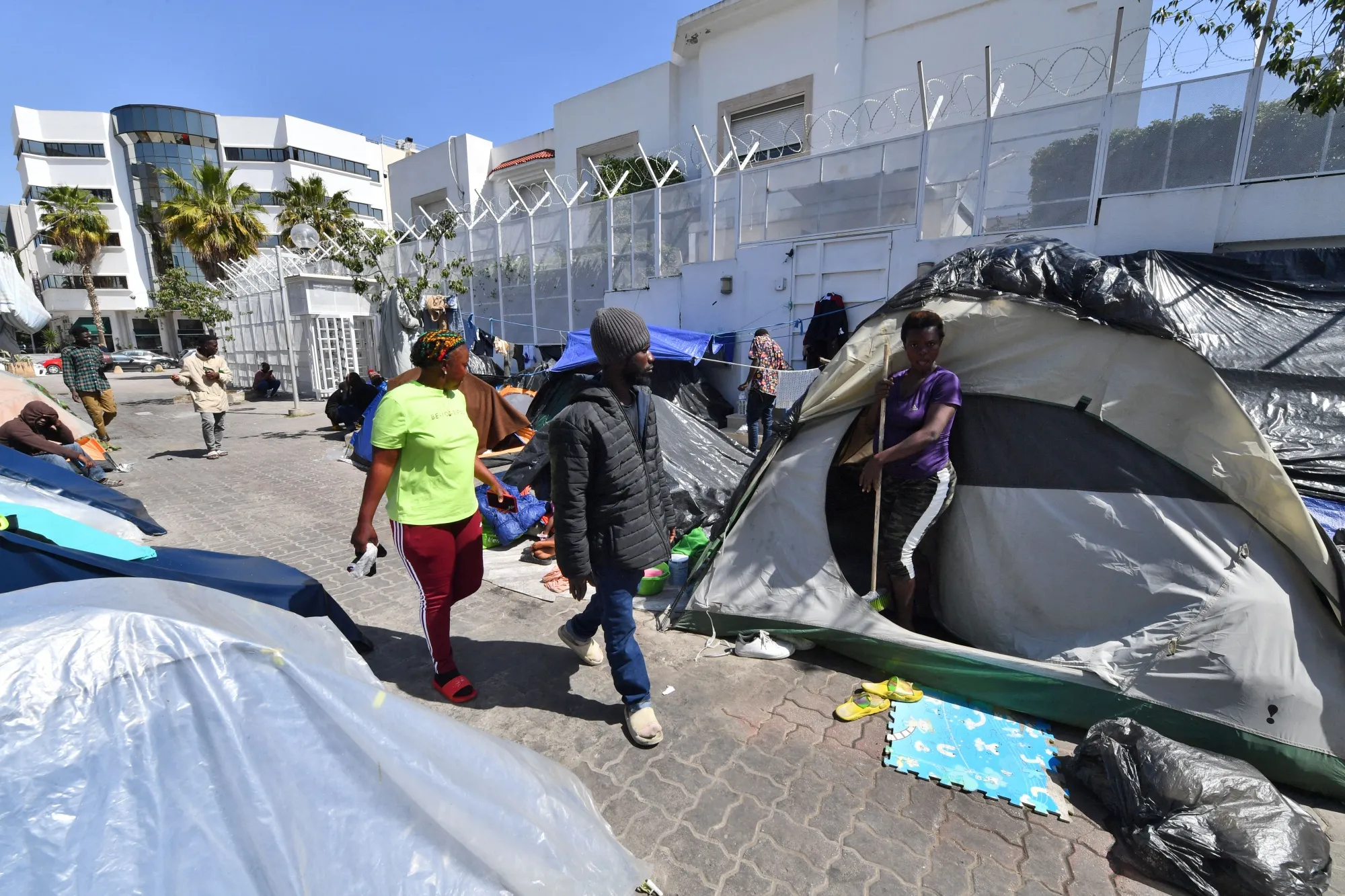 Migrants gather outside offices for the International Organisation for Migration&nbsp;in Tunis, Tunisia.&nbsp;