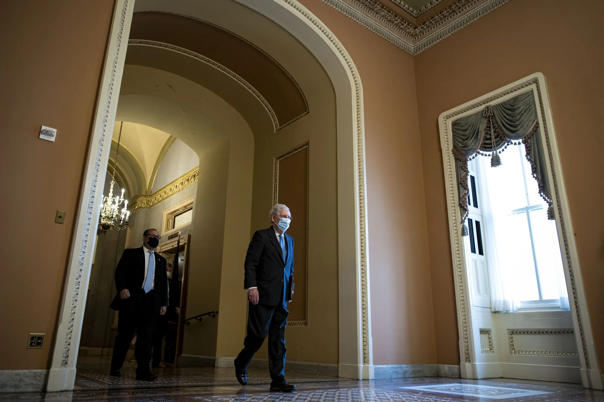 Senate Majority Leader Mitch McConnell walks to the&nbsp;Senate floor on Dec. 9.