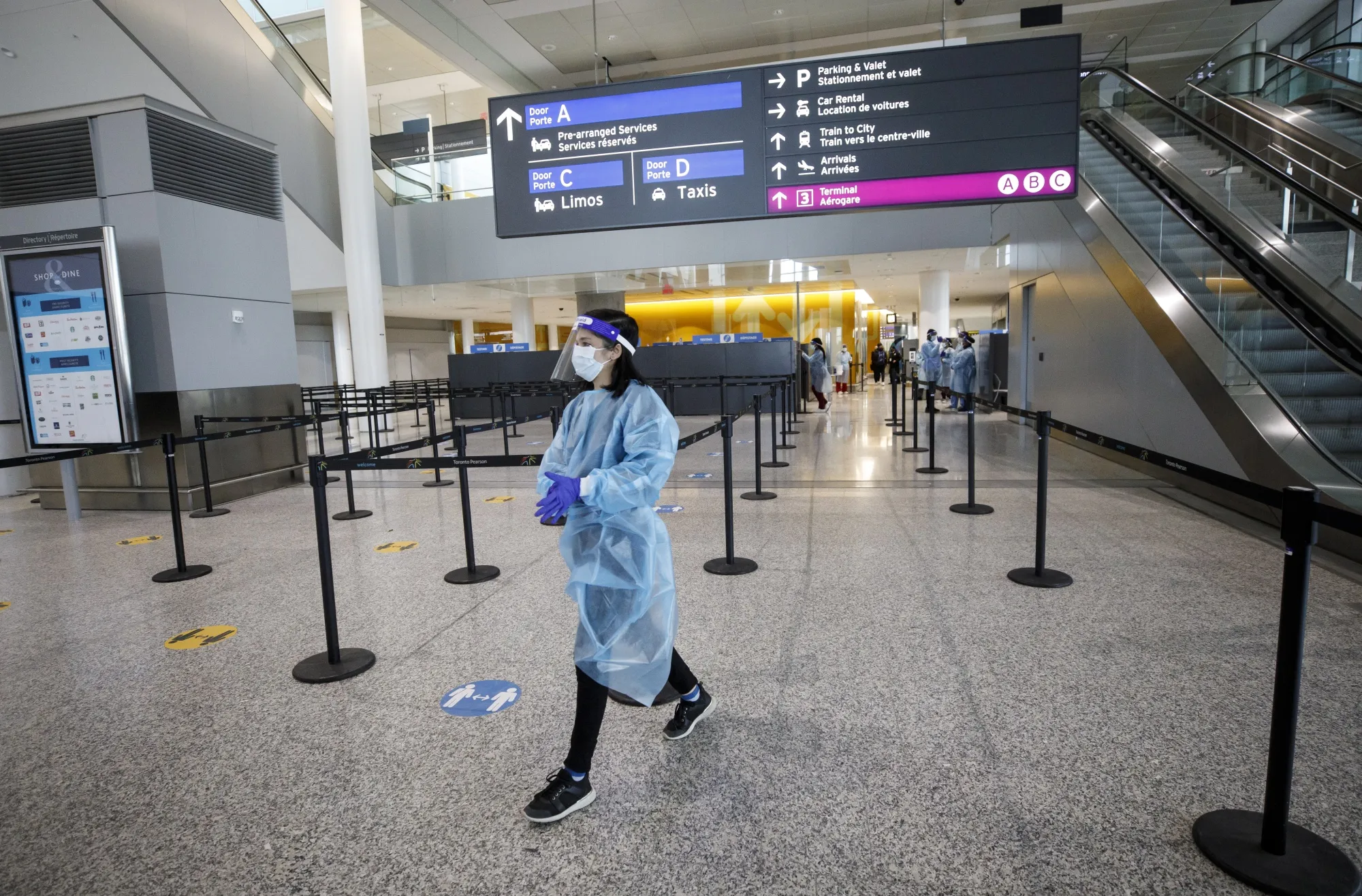 A worker walks past a mandatory Covid-19 testing area at Toronto’s Pearson International Airport in Toronto in February.