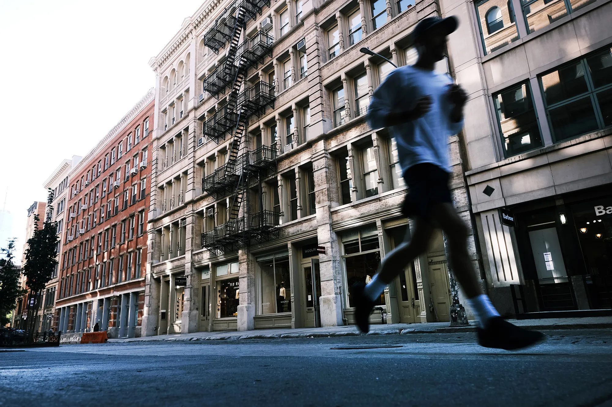 A person runs through Manhattan’s SoHo neighborhood.