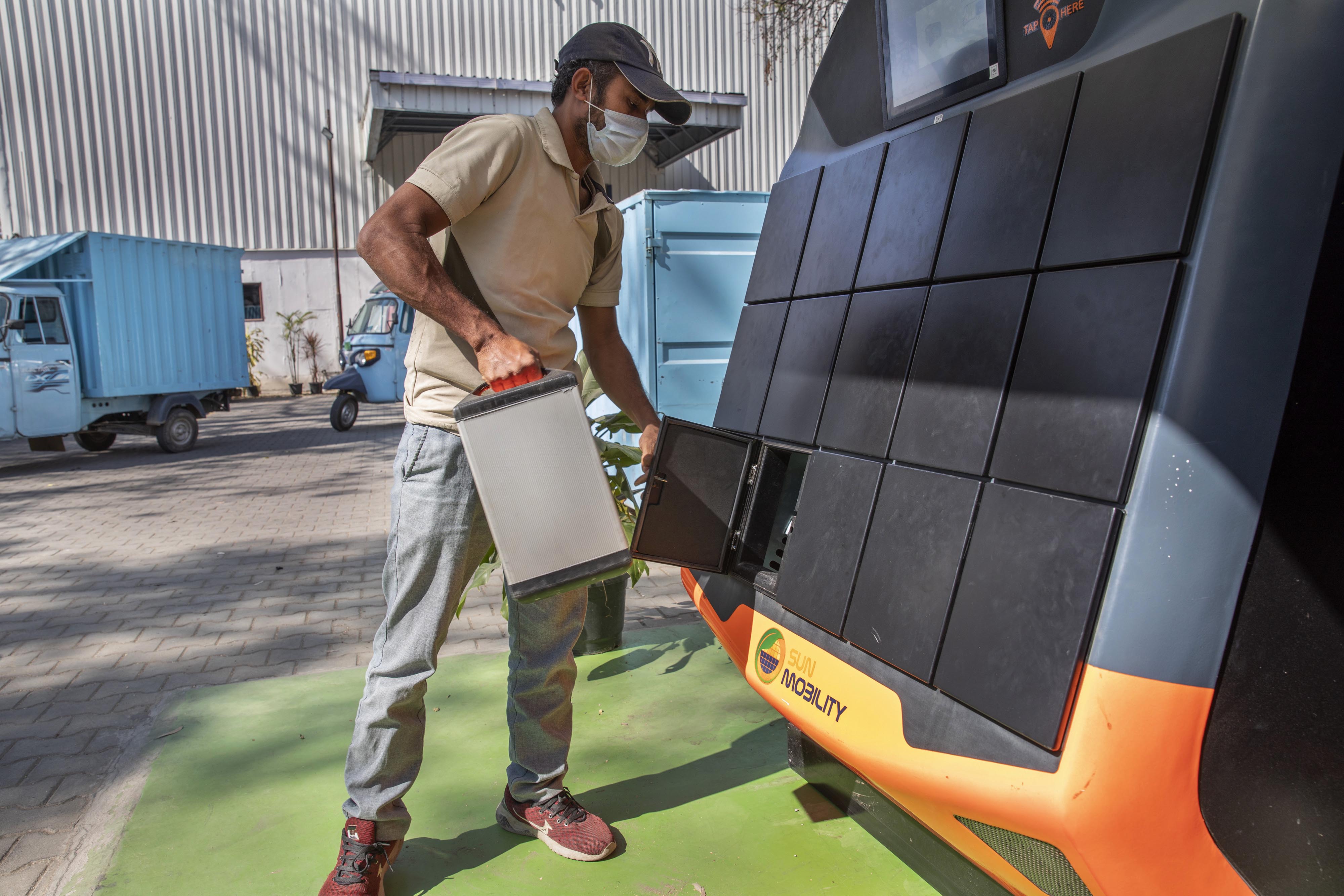 A battery is replaced at a Sun Mobility Ltd. battery swapping station in Bengaluru, India, on Friday, Feb. 11, 2022.