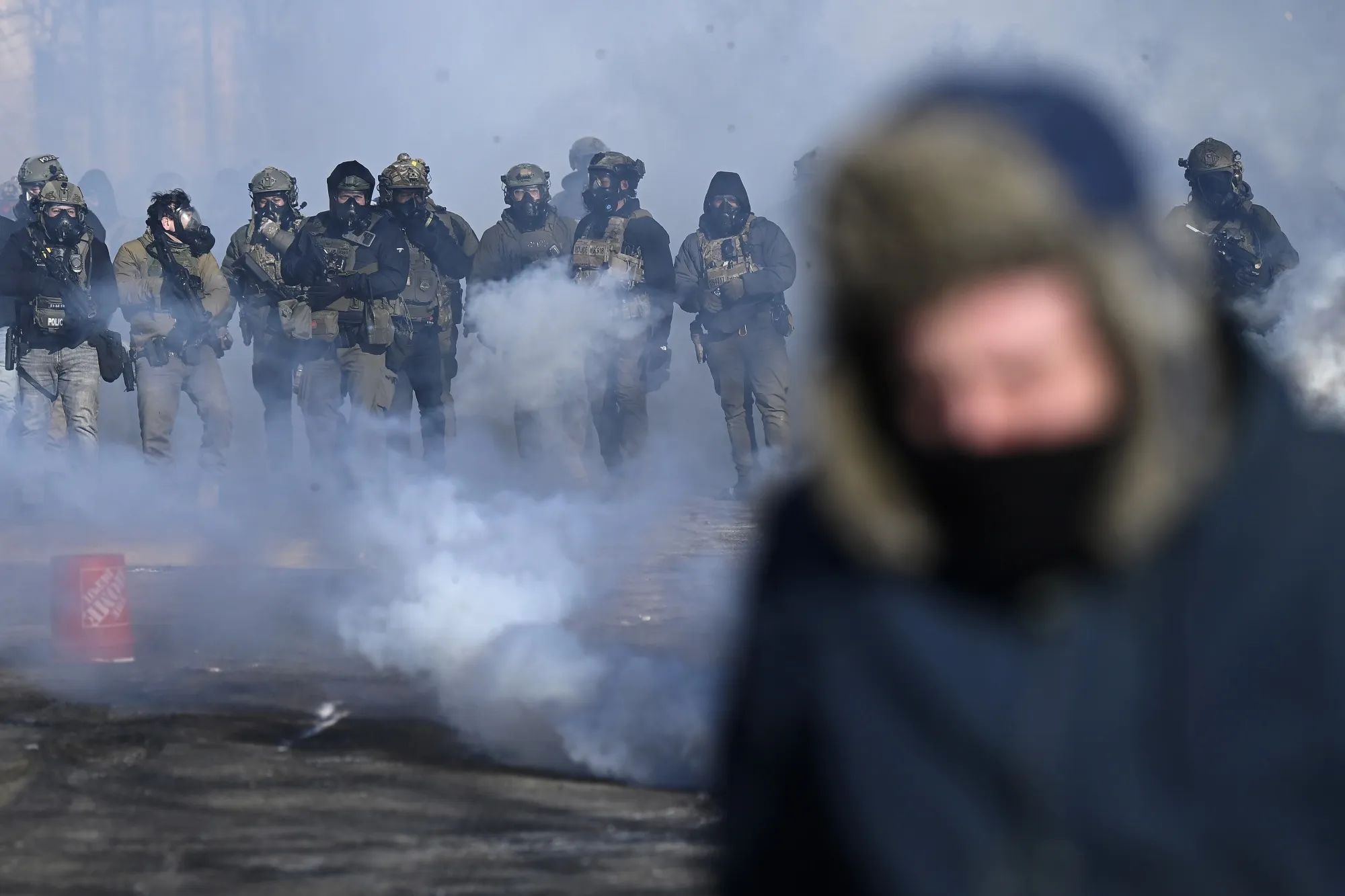 Federal agents deploy&nbsp;tear gas at protestors in Minneapolis on Jan. 24.&nbsp;