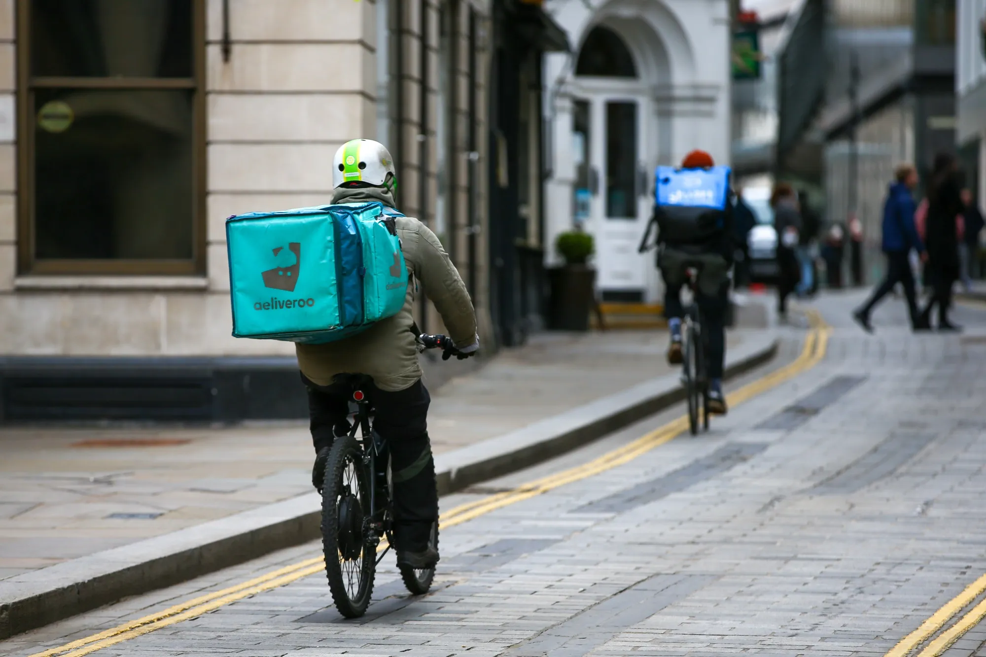 A food delivery courier for Deliveroo in London.