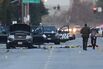 Law enforcement officials continue their investigation around the Ford SUV vehicle that was the scene where suspects of the shooting at the Inland Regional Center were killed on Dec. 4, 2015, in San Bernardino, California.

