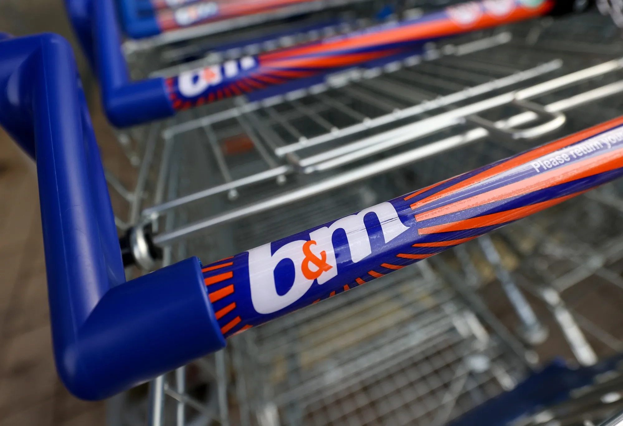 Trolleys outside a B&amp;M Bargains store, operated by B&amp;M European Value Retail SA, in Ipswich, UK.