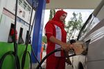 An attendant refuels a vehicle at a PT Pertamina gas station in Jakarta, Indonesia, on Tuesday, Nov. 16, 2021. 