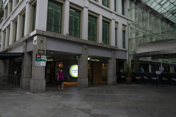 Singapore’s Reopening Commitment Faces Test in New Clusters